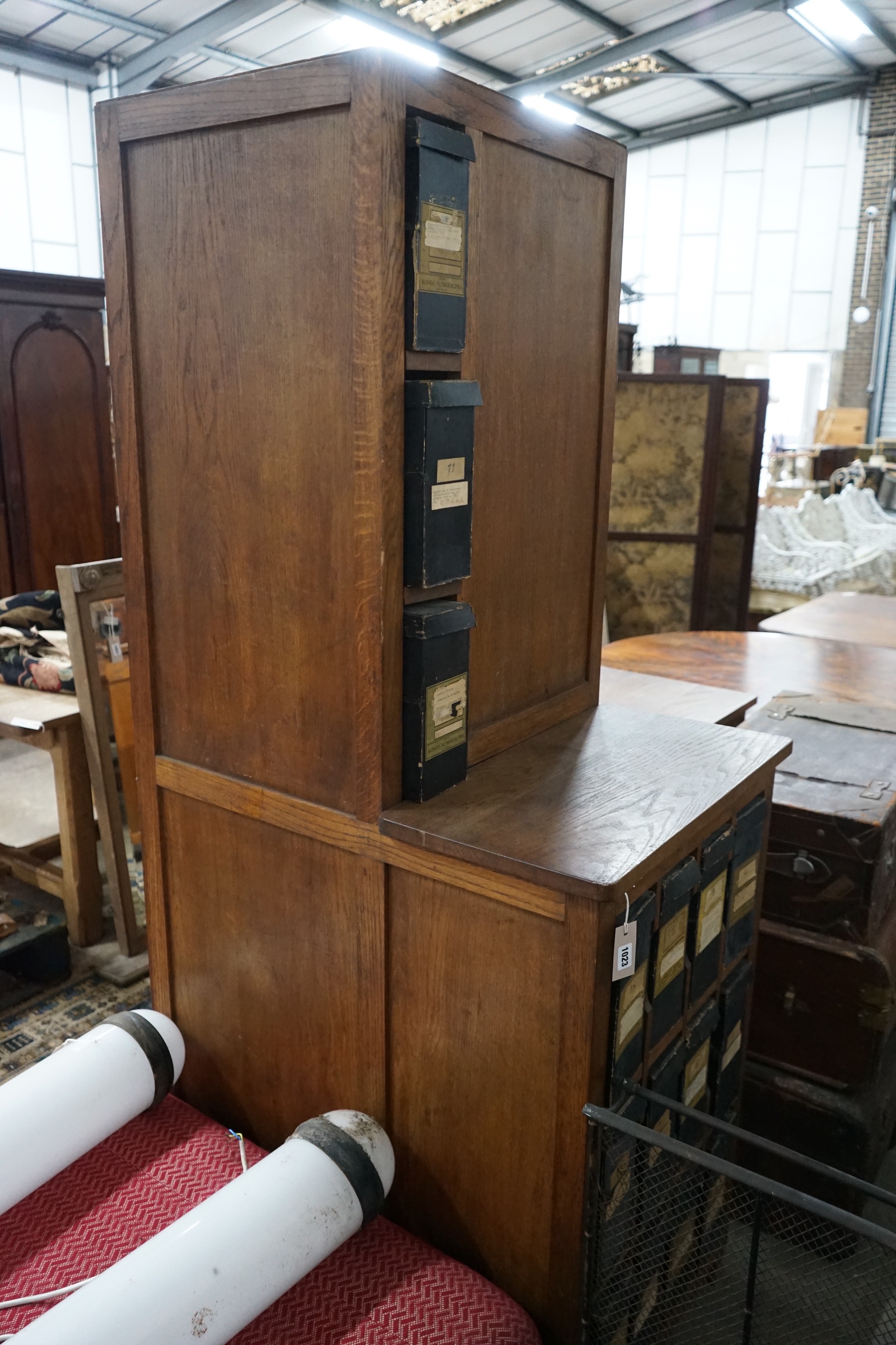 An early 20th century oak stationery desk, width 166cm, height 199cm